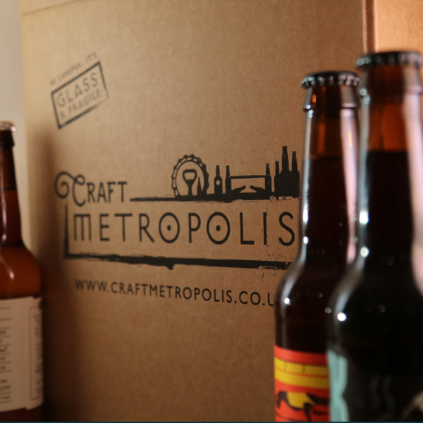 Craft Metropolis packaging box and bottles of beer